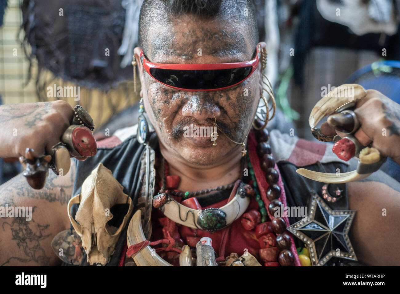 Tattooed punk man in the Chatuchak weekend market Stock Photo