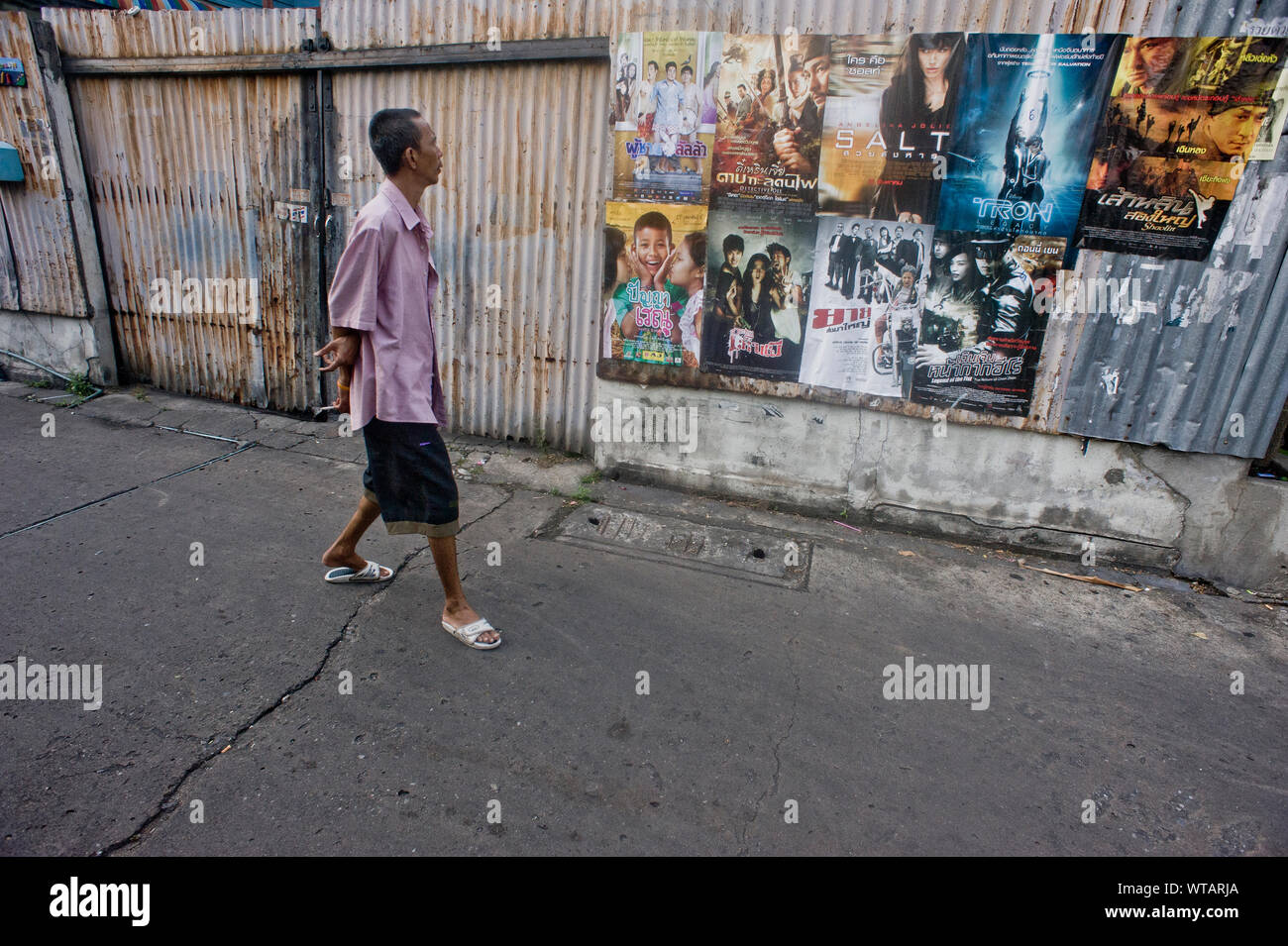 Man checks movies posters Stock Photo