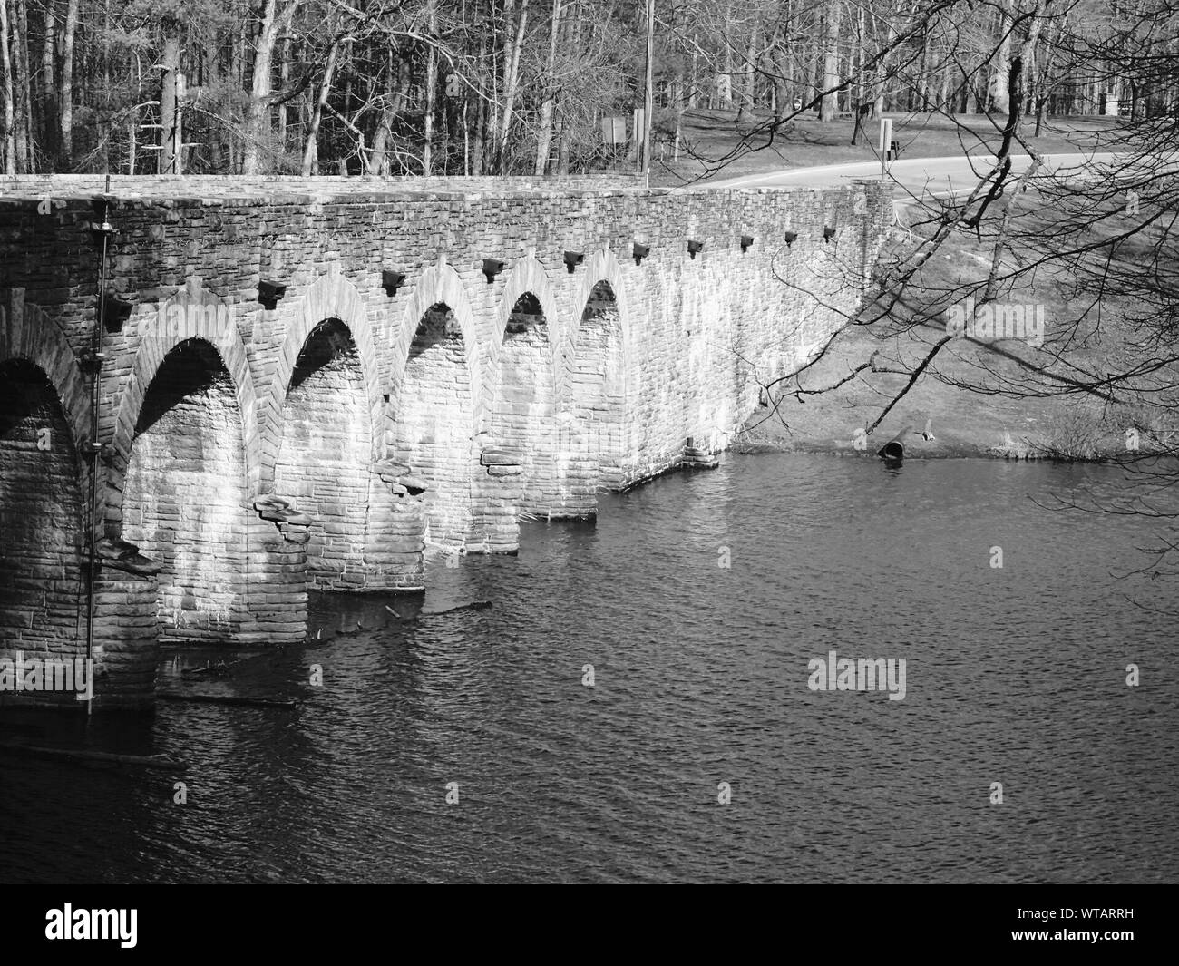 Reflection arch bridge in river arch Black and White Stock Photos ...