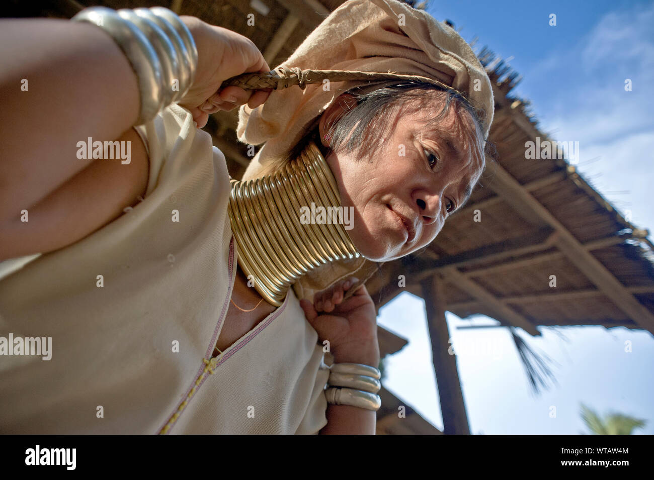 Mubah carries rice in the Longneck Karen Village (refugee camp) Stock Photo