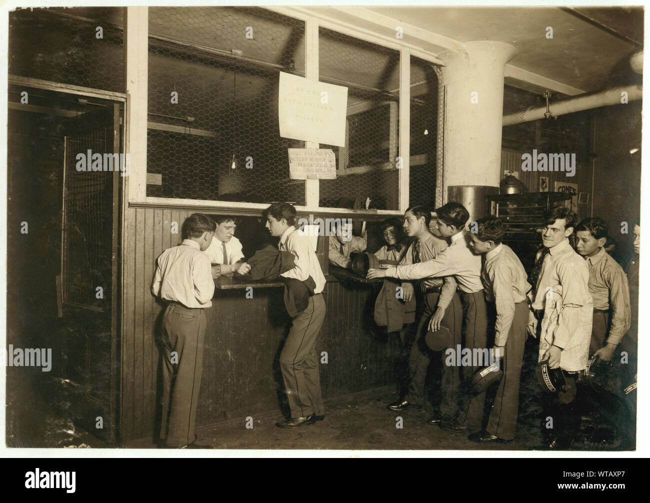 Messengers at the main office, Postal Telegraph Co., 283 B'way, turning in their uniforms at close of the day. The boys are carefully supervised and clothes are well kept.  Photographs from the records of the National Child Labor Committee (U.S.) Stock Photo