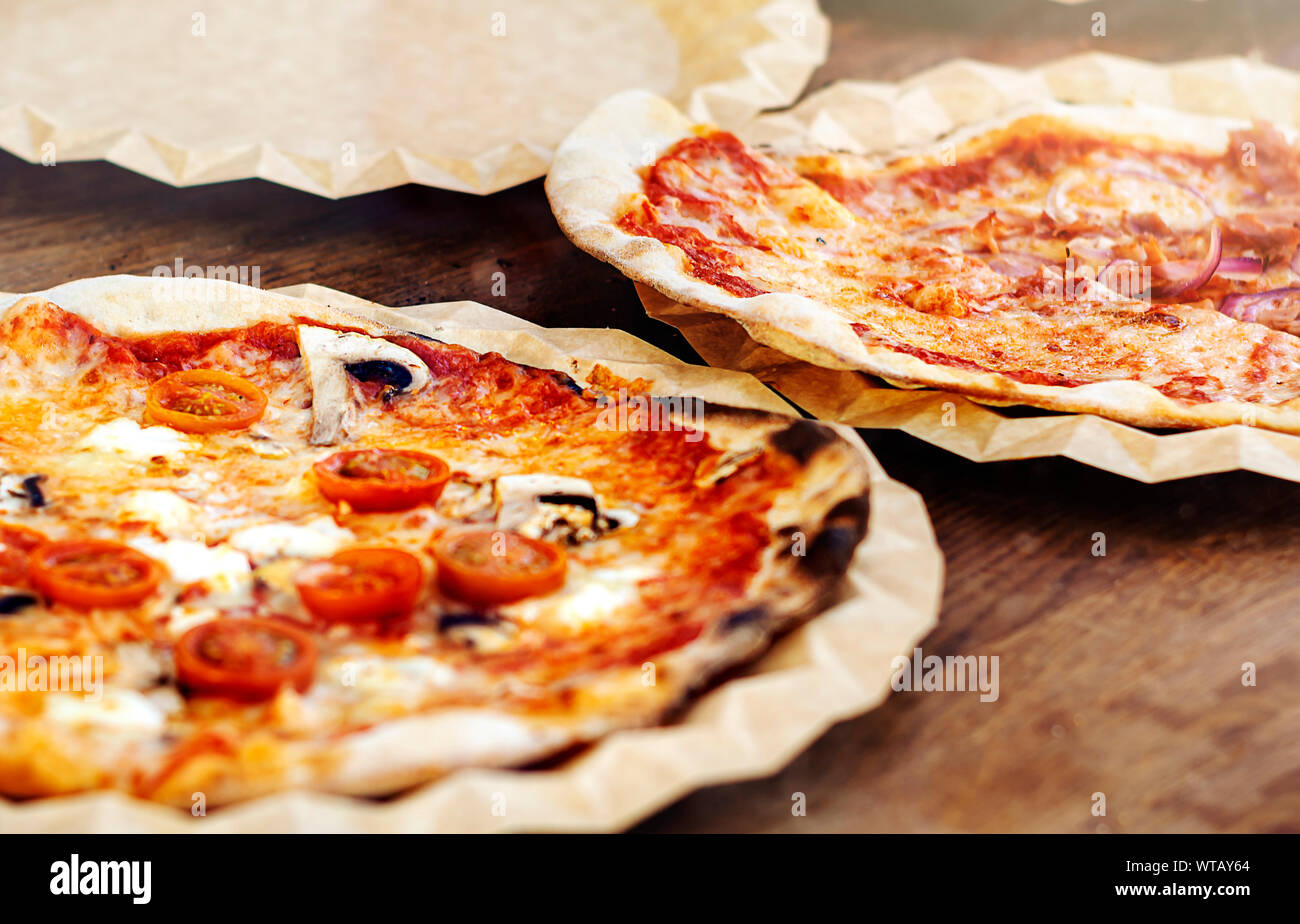 Freshly baked margherita pizza topped with tomato sauce, mozzarella and mushrooms. Typical recipe of Italian cuisine Stock Photo