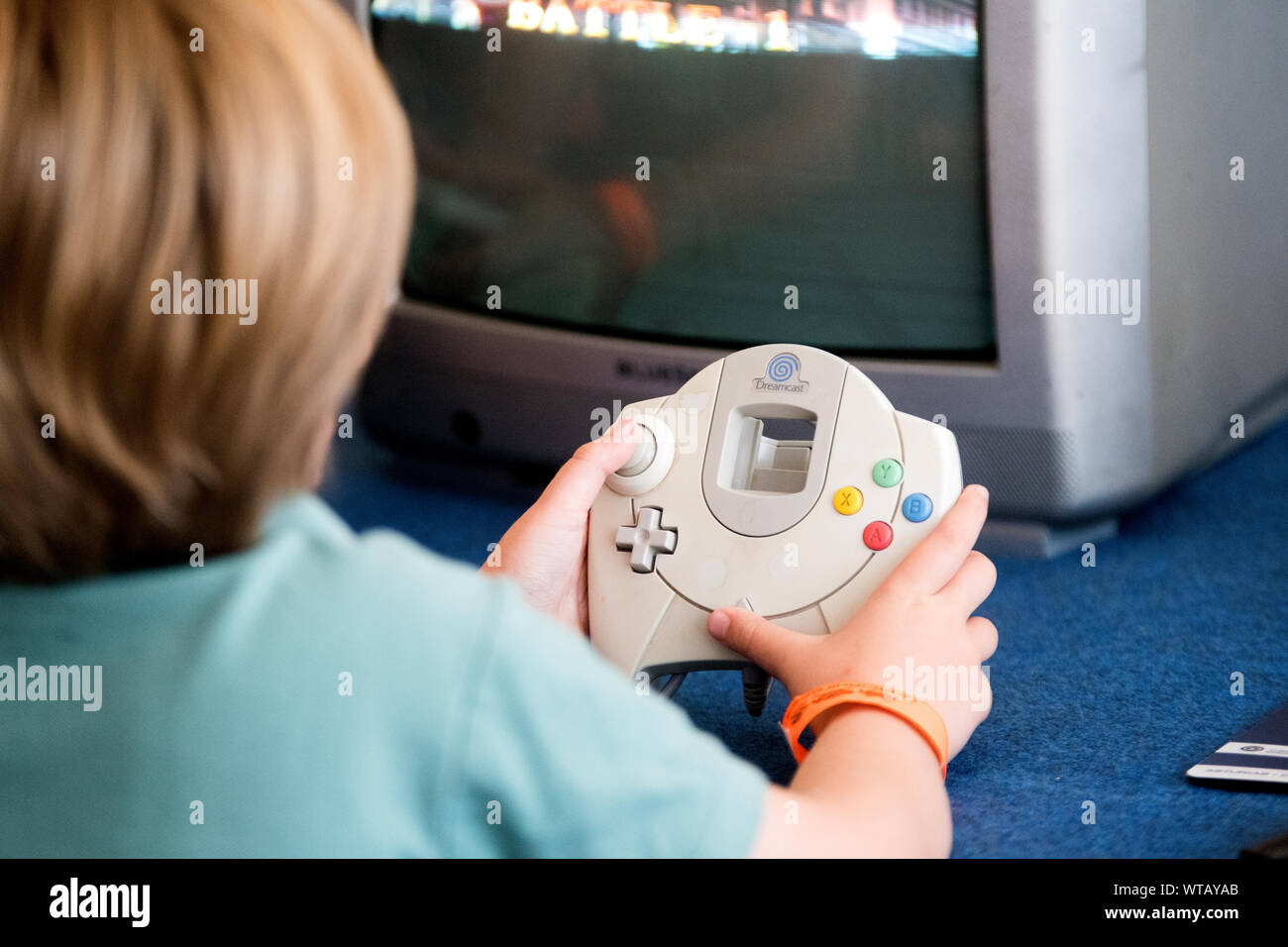 Oviedo, Spain. 10th September, 2019. A boy plays with a Sega Dreamcast console during the 'Marcianito Fest', a festival of arcade machines and old consoles, on September 10, 2019 in Oviedo, Spain. © David Gato/Alamy Live News Stock Photo