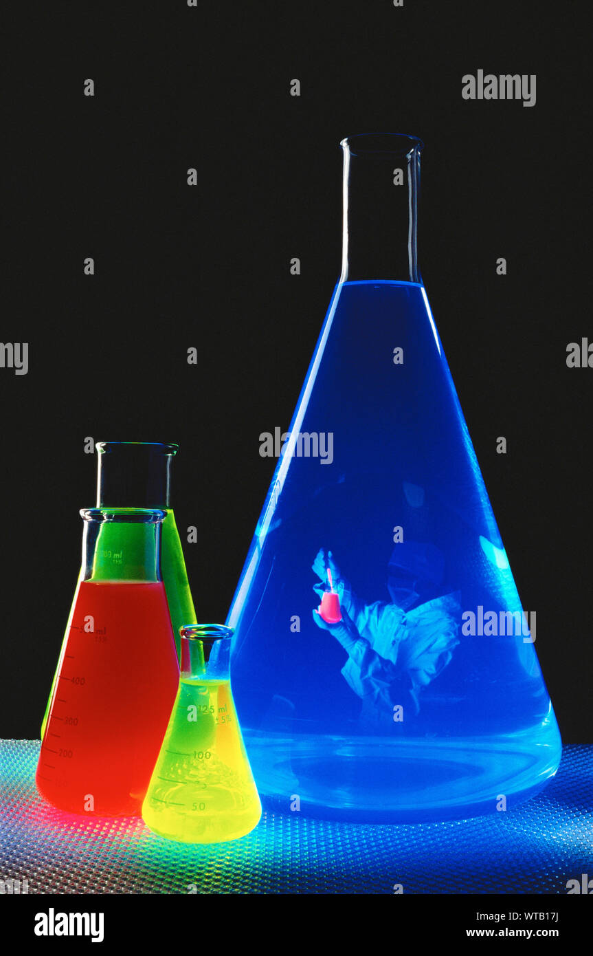 Chemistry Flasks and Laboratory Technician Stock Photo