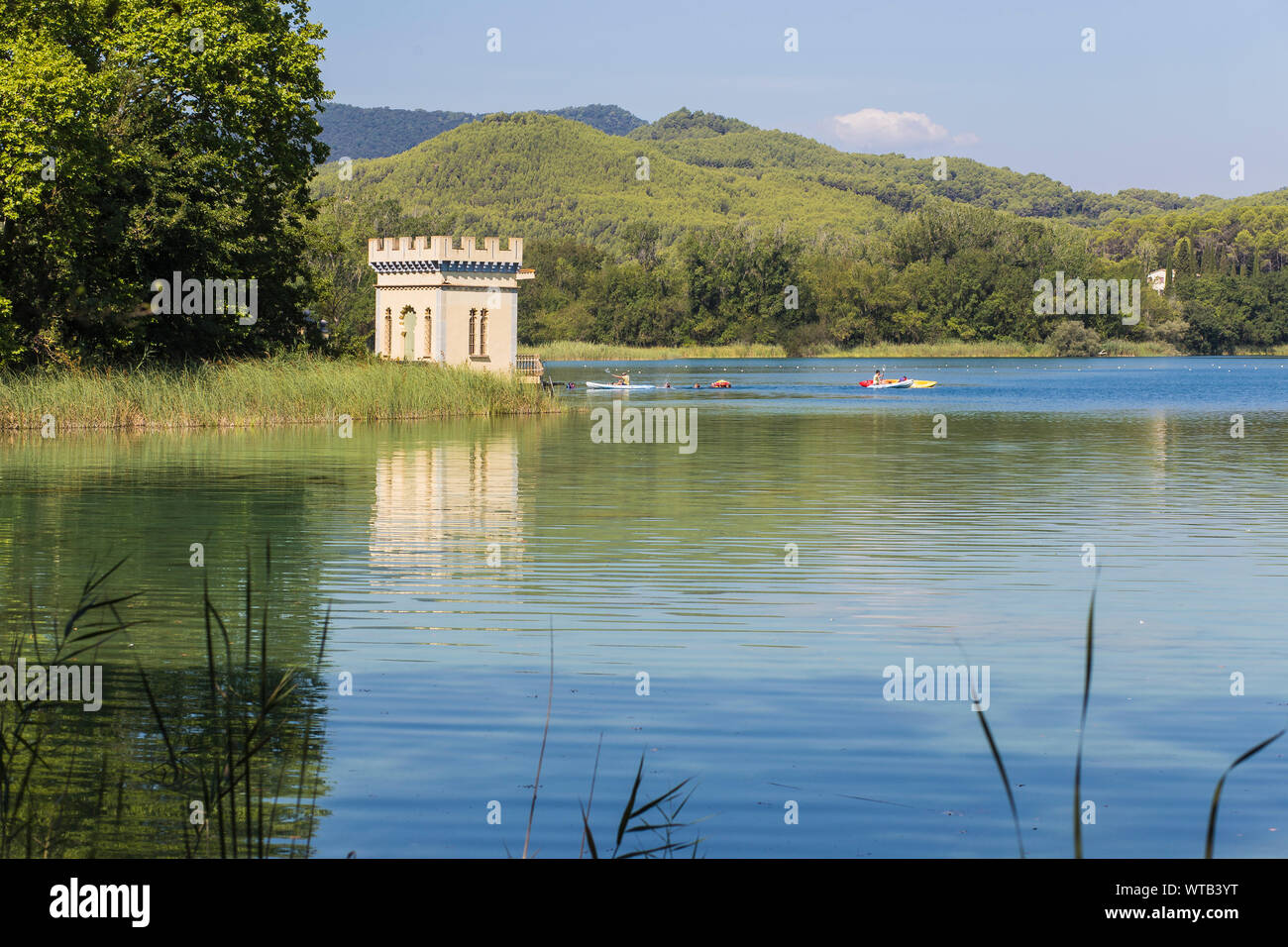 Quiet blue waters with plants in a landscape in Estany de Banyoles, Catalonia Stock Photo