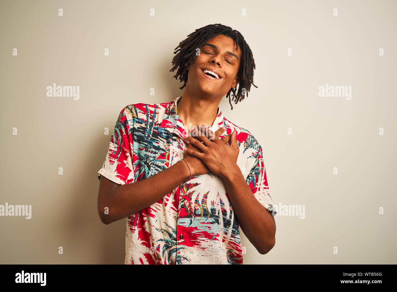 Dreadlocks Chest Afro man with dreadlocks on vacation wearing summer shirt over isolated ...