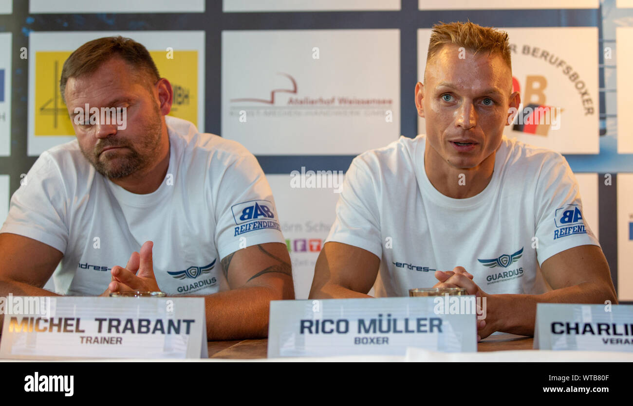 Berlin, Germany. 11th Sep, 2019. Boxing: Super light weight, World Championship, press conference before the IBO World Championship fight Müller (Germany) - Ponce (Argentina) in the Loretta at the Spree. Boxer Rico Müller (r) speaks in the press conference next to his coach Michel Trabant. Credit: Andreas Gora/dpa/Alamy Live News Stock Photo