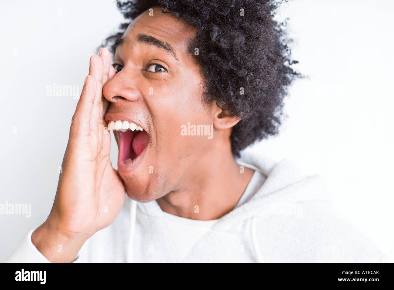 Handsome African American Man With Afro Hair Over White Background