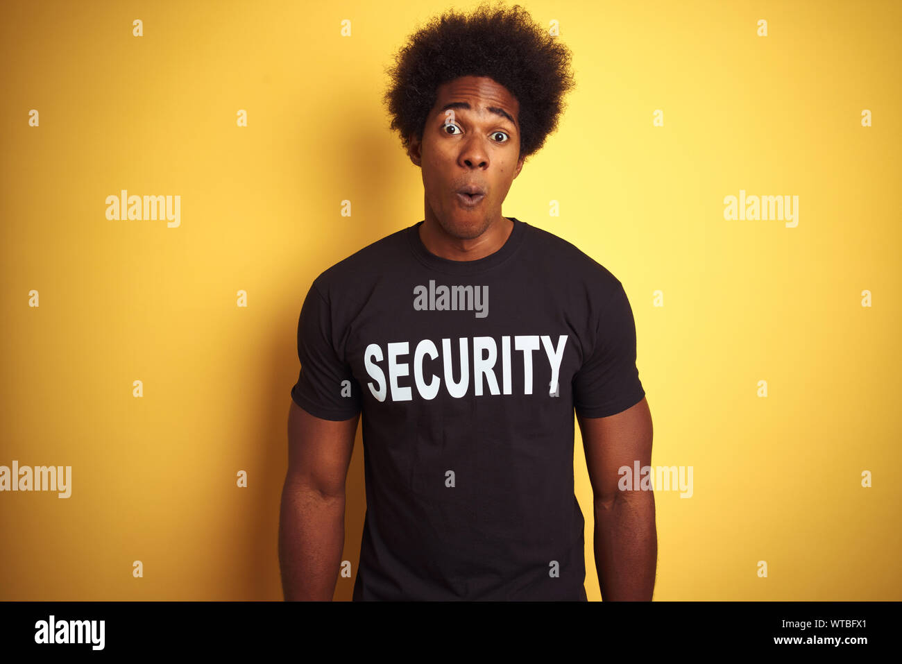 American safeguard man with afro hair wearing security uniform over ...