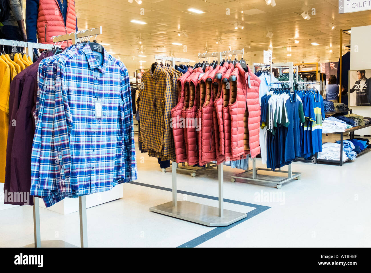 Racks of mens clothing for sale in a Marks and Spencer store in Truro in Cornwall. Stock Photo