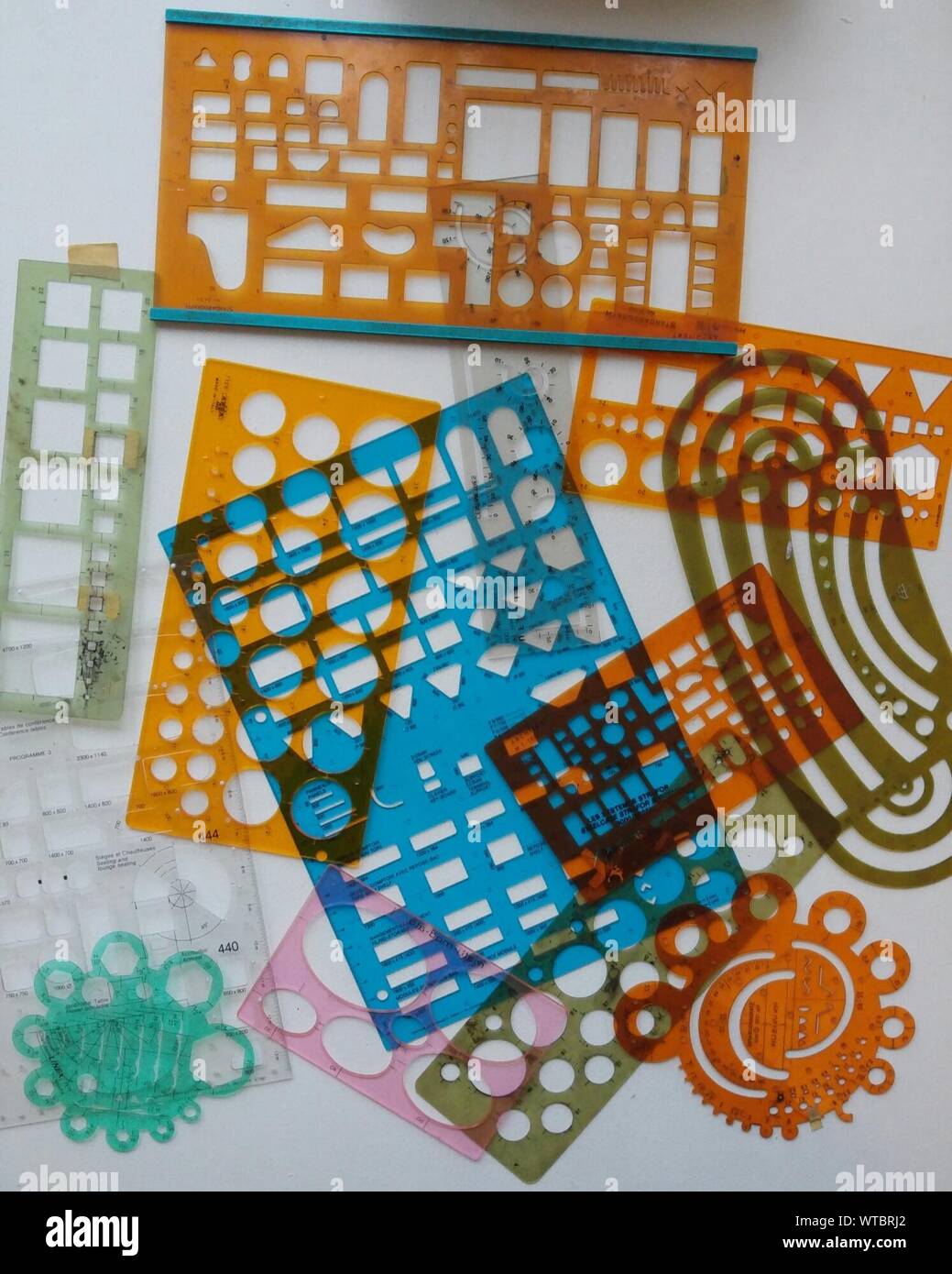 Directly Above Shot Of Various Stencils On Table Stock Photo