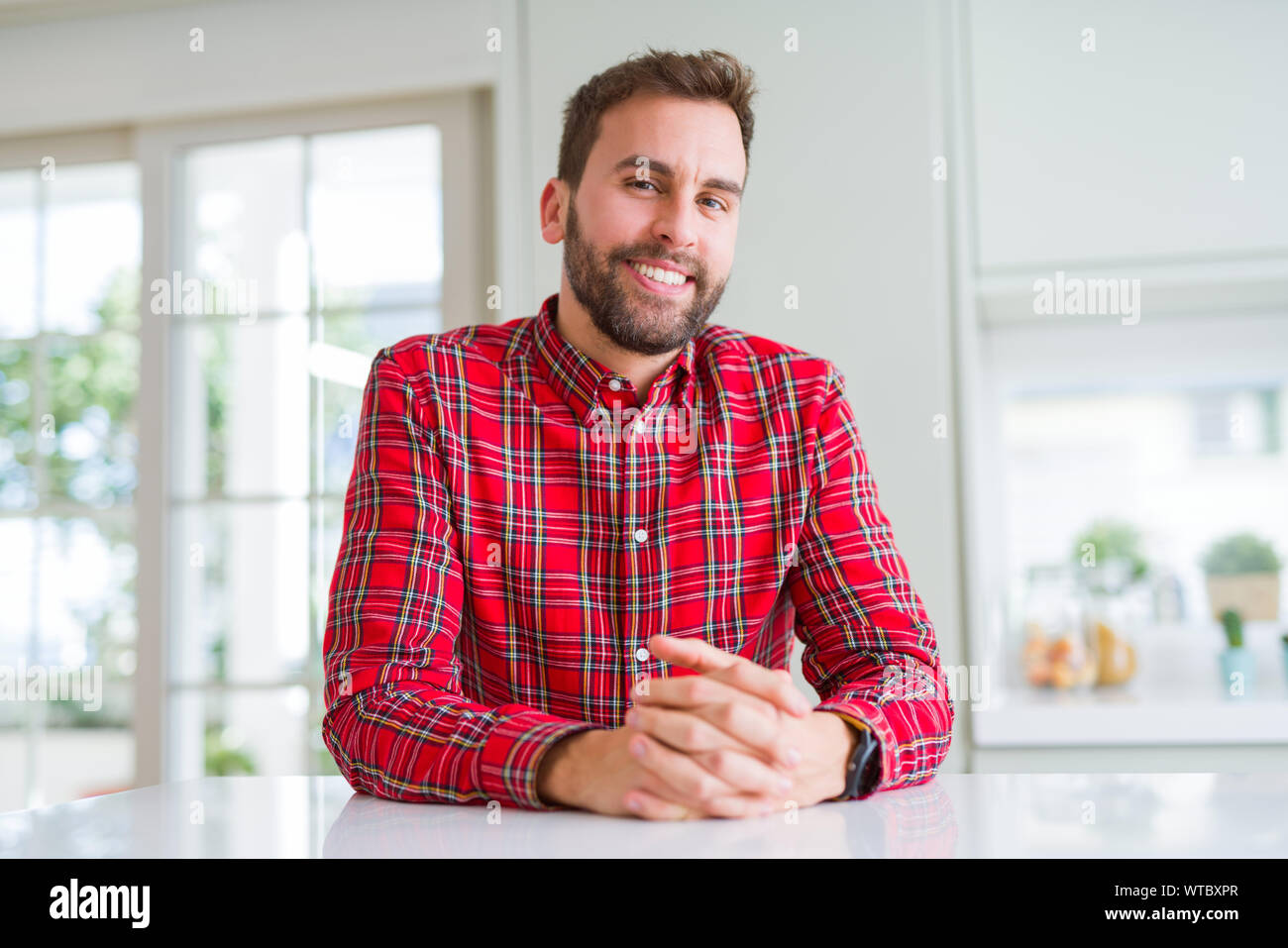 Handsome man smiling positive at the camera Stock Photo - Alamy