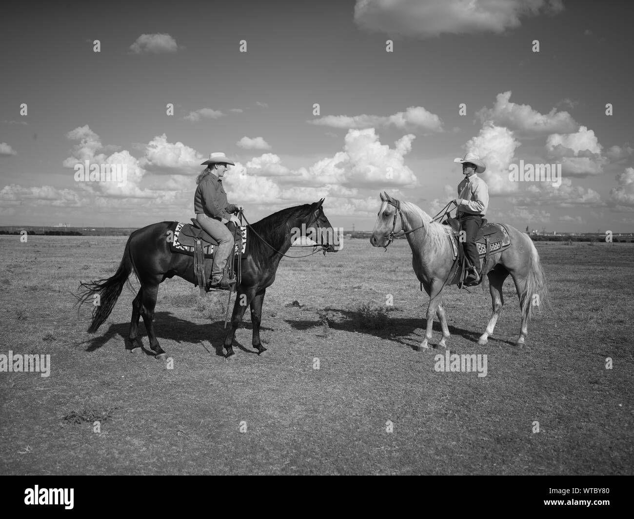 Michelle Cannon, left, and Wade Meador at the Cannon Quarter Horse ranch near the town of Venus in north-central Texas Stock Photo
