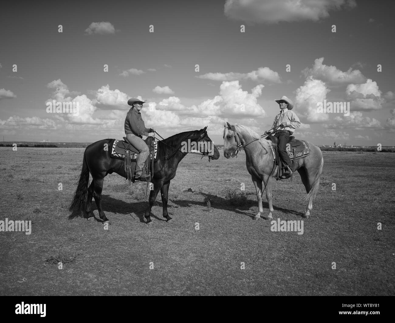 Michelle Cannon, left, and Wade Meador at the Cannon Quarter Horse ranch near the town of Venus in north-central Texas Stock Photo