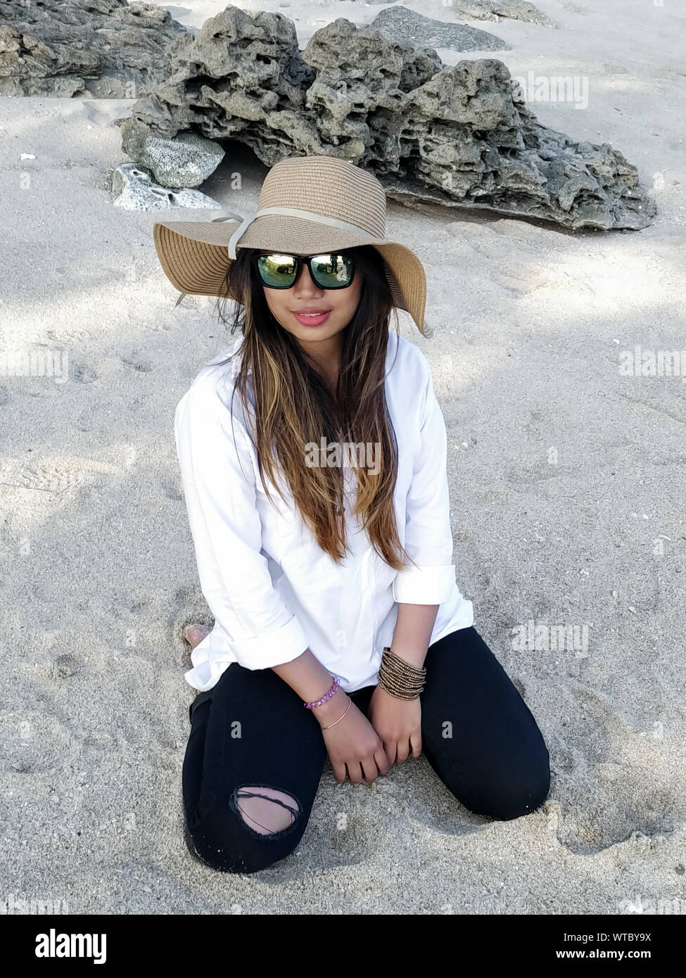 Young Woman Kneeling Beach High Resolution Stock Photography and Images ...