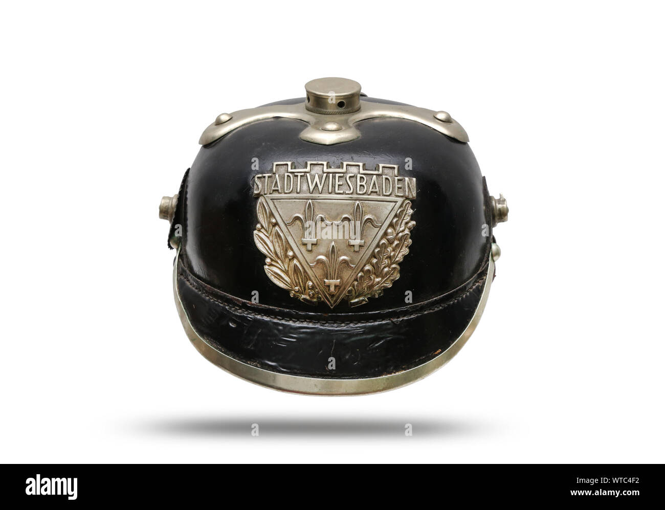German WWI police black leather helmet of the city of Wiesbaden in the western German state of Hesse. With Wiesbaden helmet plate of white stamped met Stock Photo