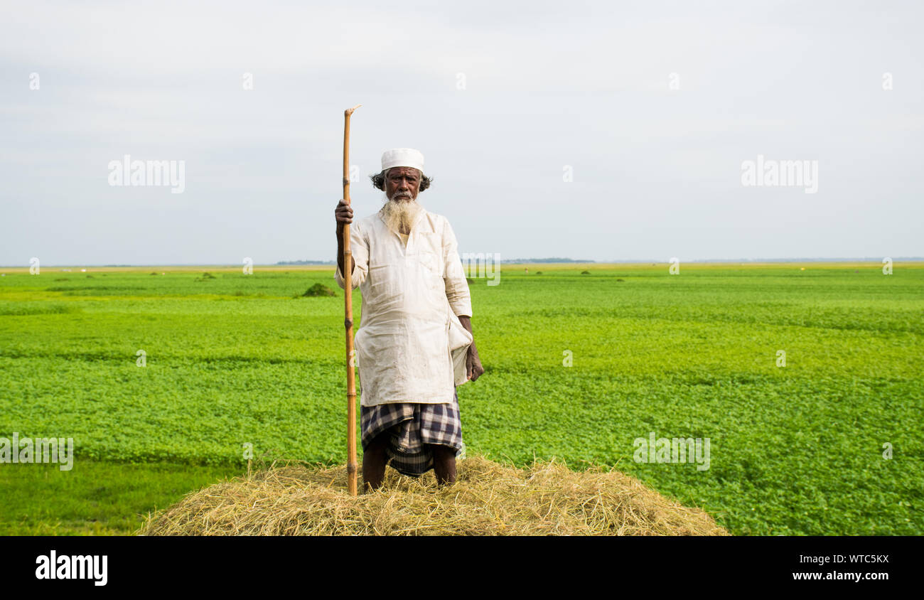 A Rikshaw poller face on street of bd. Stock Photo