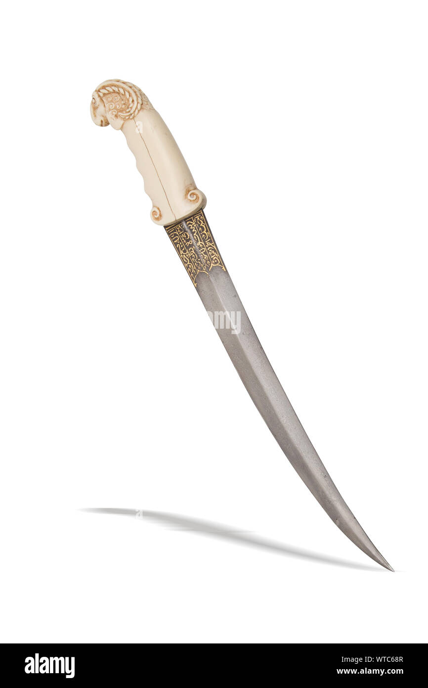Indian islamic dagger elephant grip as Ram headI.18th century Curved double-edged Damascus steel blade of flatten diamond shape with gold inlay at for Stock Photo