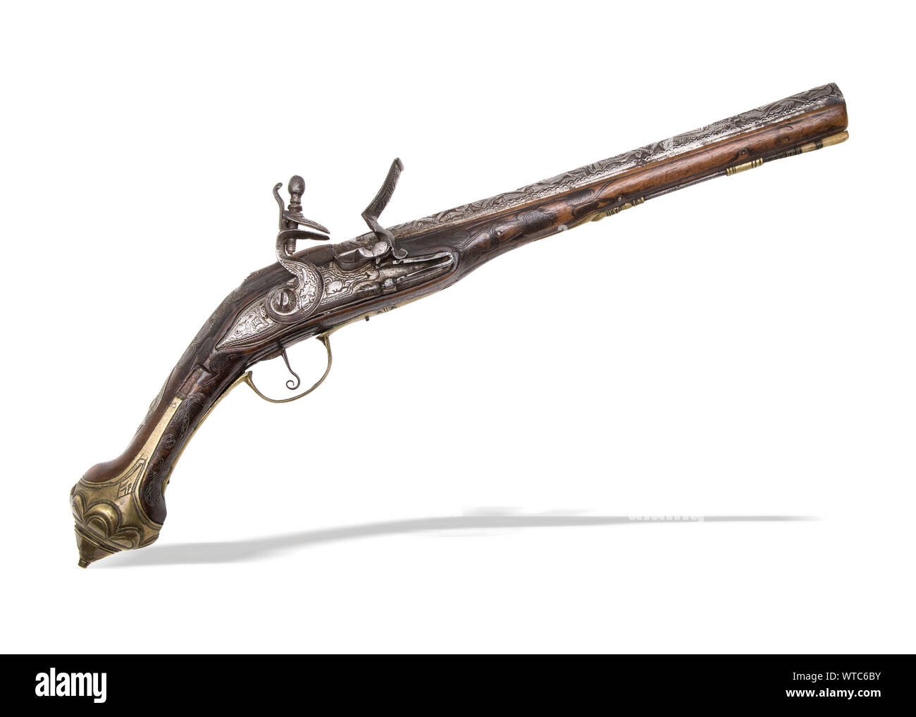 Middle Eastern engraved flinlock pistol of the 19th century. Stock Photo