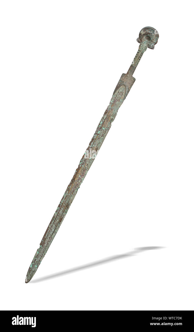 A Luristan Bronze sword.Bronze Sword circa 9th -7th century B.C. Straight blade with four ribs, ribbed handle with eared pommel. Stock Photo