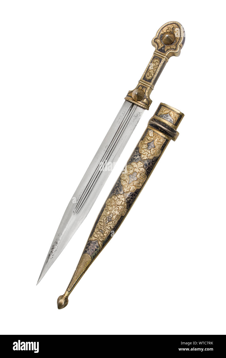 Russian or soviet Kubachi silver mounted dagger of the 20th century. Caucasian dagger in gilded silver mounts decorated with engraving and niello. Stock Photo
