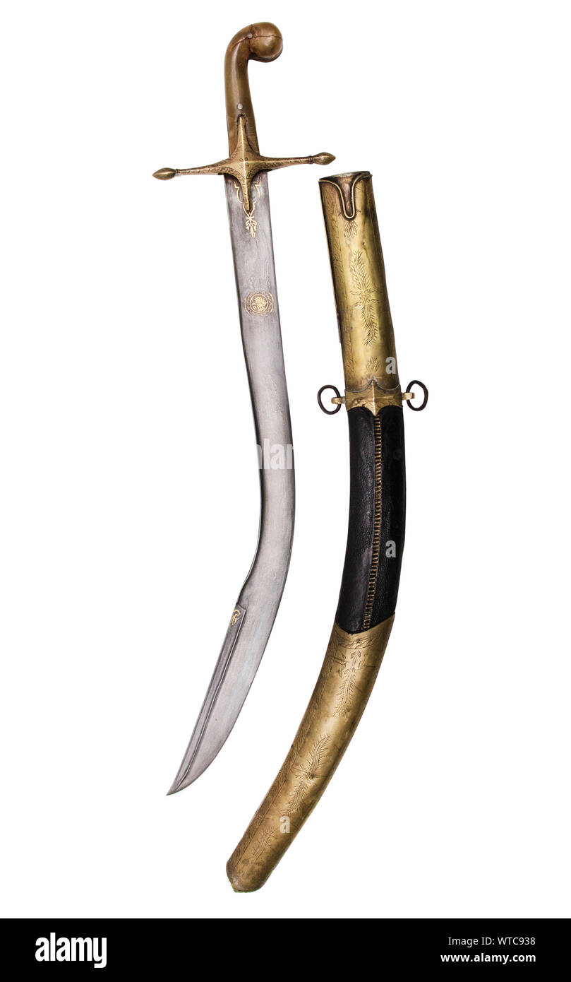 19th century Turkish pala sword. With massive Damascus steel blade with pronounced spine decorated with gold inlay. Blade is curved, single-edged with Stock Photo