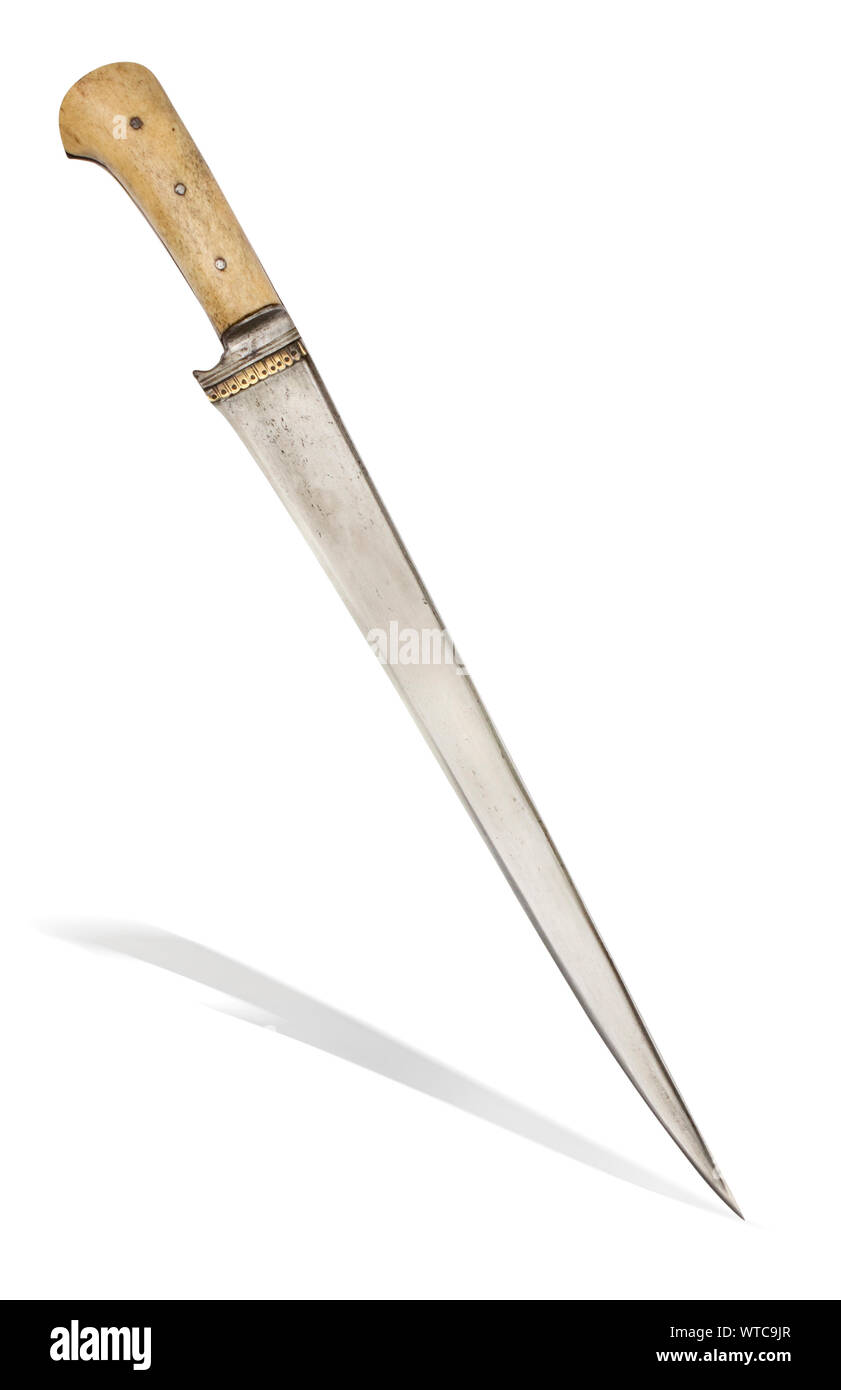 The 19th century Afghan khyber knife of traditional design. The cutting steel blade with the edge faceted. Stock Photo