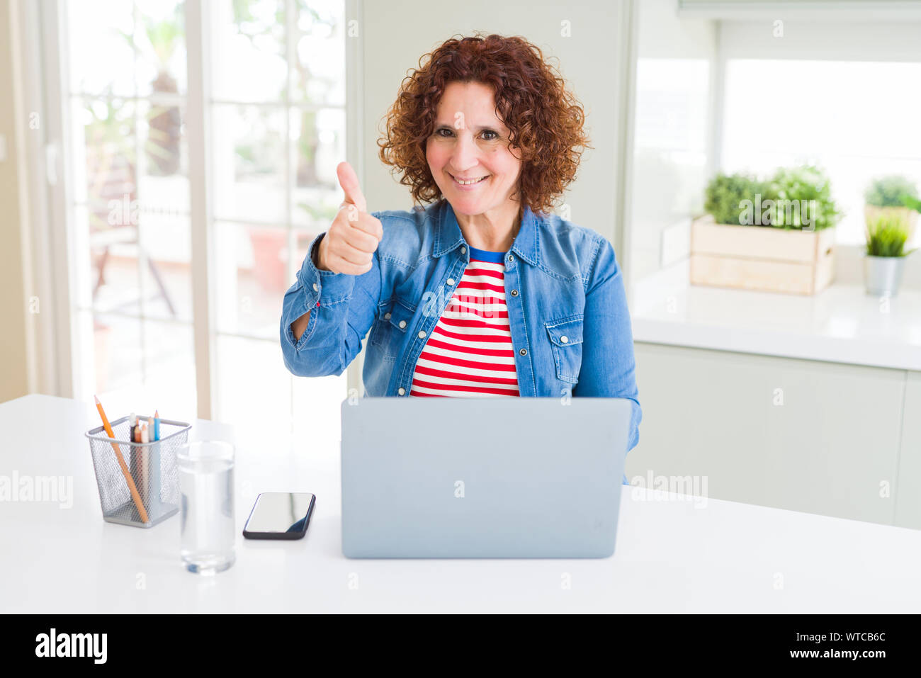Senior woman working using computer laptop happy with big smile doing ...