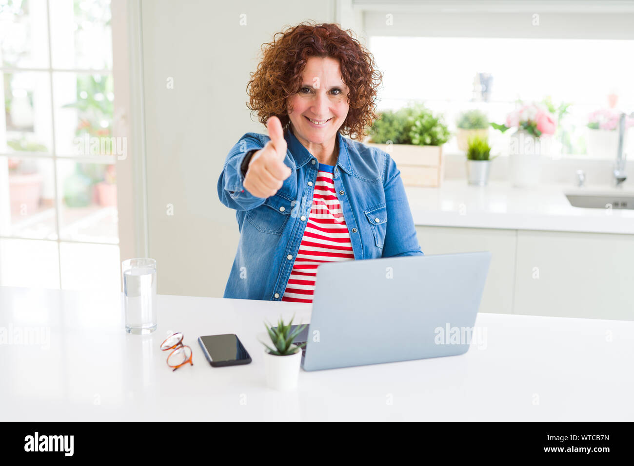 Senior woman working using computer laptop happy with big smile doing ...