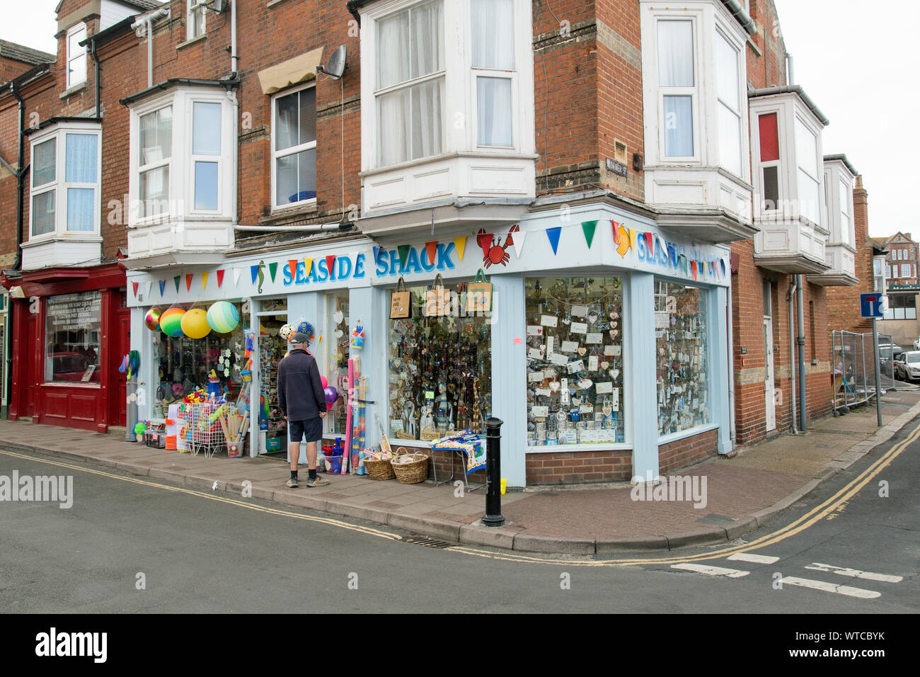 Cromer, Norfolk, England, September 8th, 2019, A man browses the windows of a seaside gift shop