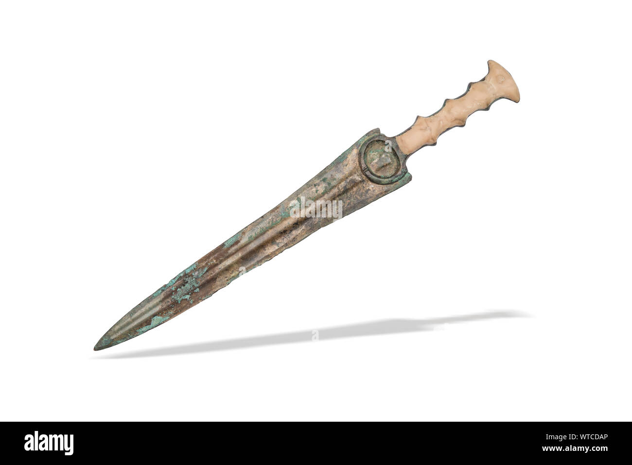 A near east, Iran, Luristan 2nd to 1st millennium BC bronze dagger. It has a long blade that boasts a prominent blood ridge on both sides as well as a Stock Photo