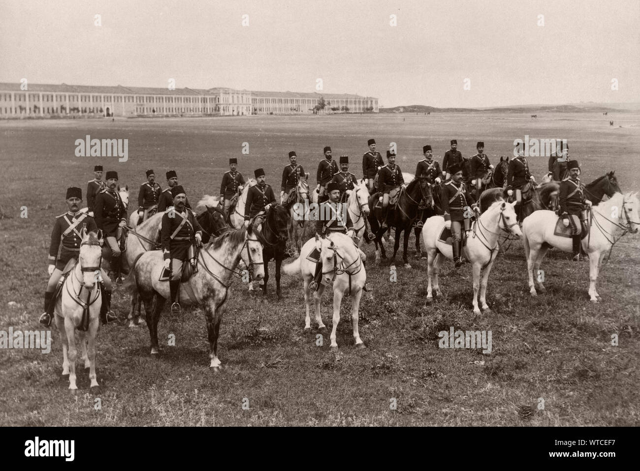 Officers of a regiment of lancers, on horseback in field in front of barracks. Turkey (Ottoman Empire). Istanbul, end of the 19th century. Stock Photo