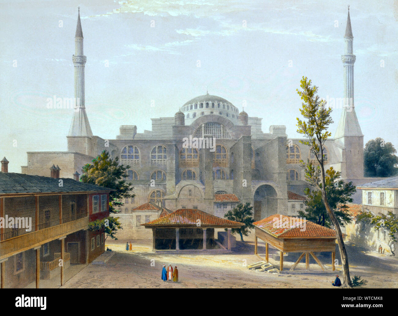 Madrasah courtyard and exterior of Ayasofya Mosque, formerly the Church of Hagia Sophia, ancient Greek ablution fountains in the foreground; with grou Stock Photo