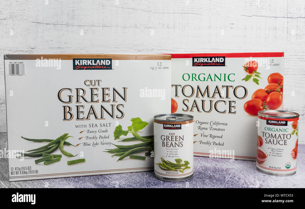 Worcester, PA - August 28, 2019: Kirkland Cut Green Beans and Organic Tomato Sauce cases of 12 cans are sold at Costco Wholesale at their warehouse cl Stock Photo