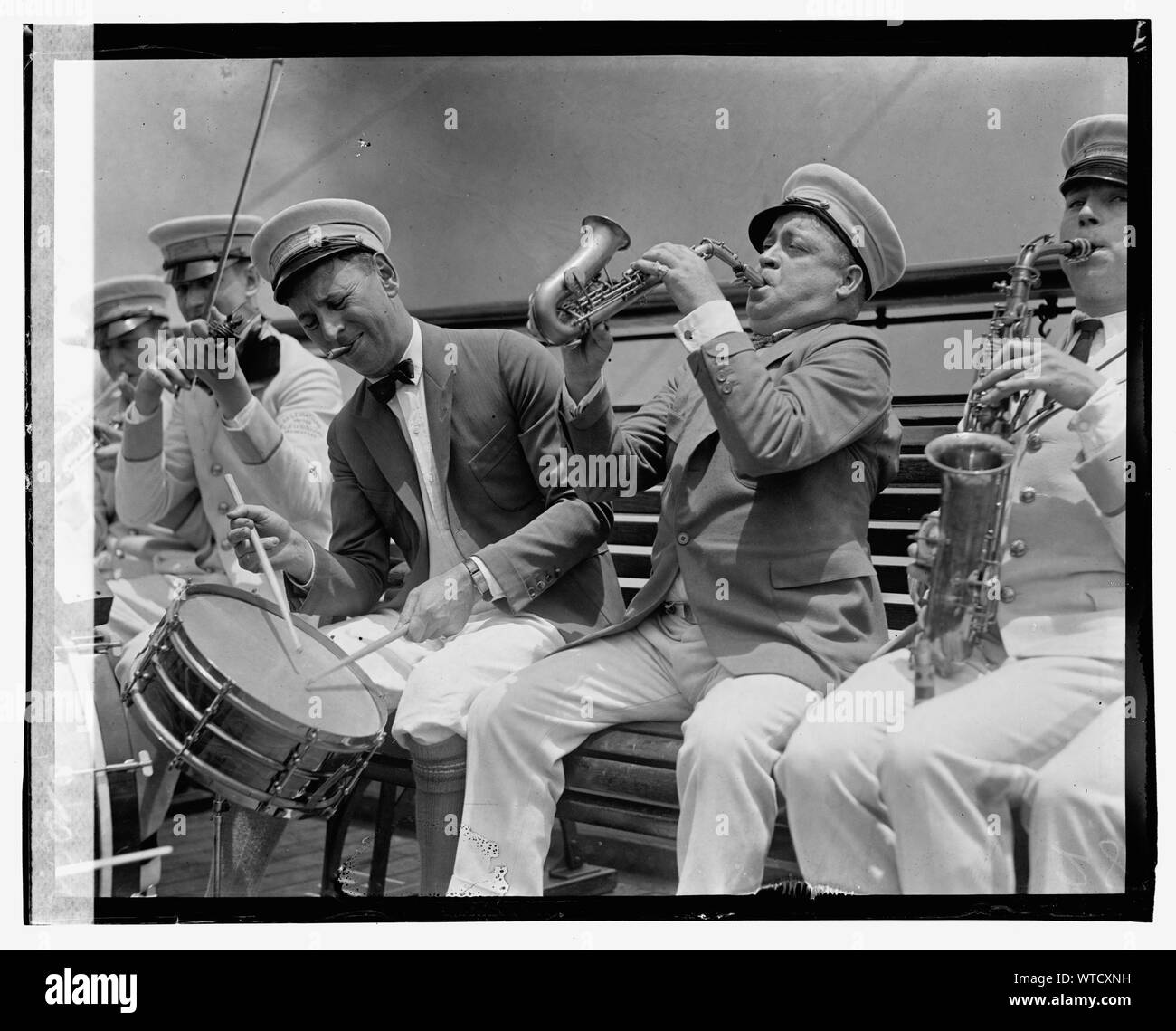 Military band members playing instruments Stock Photo