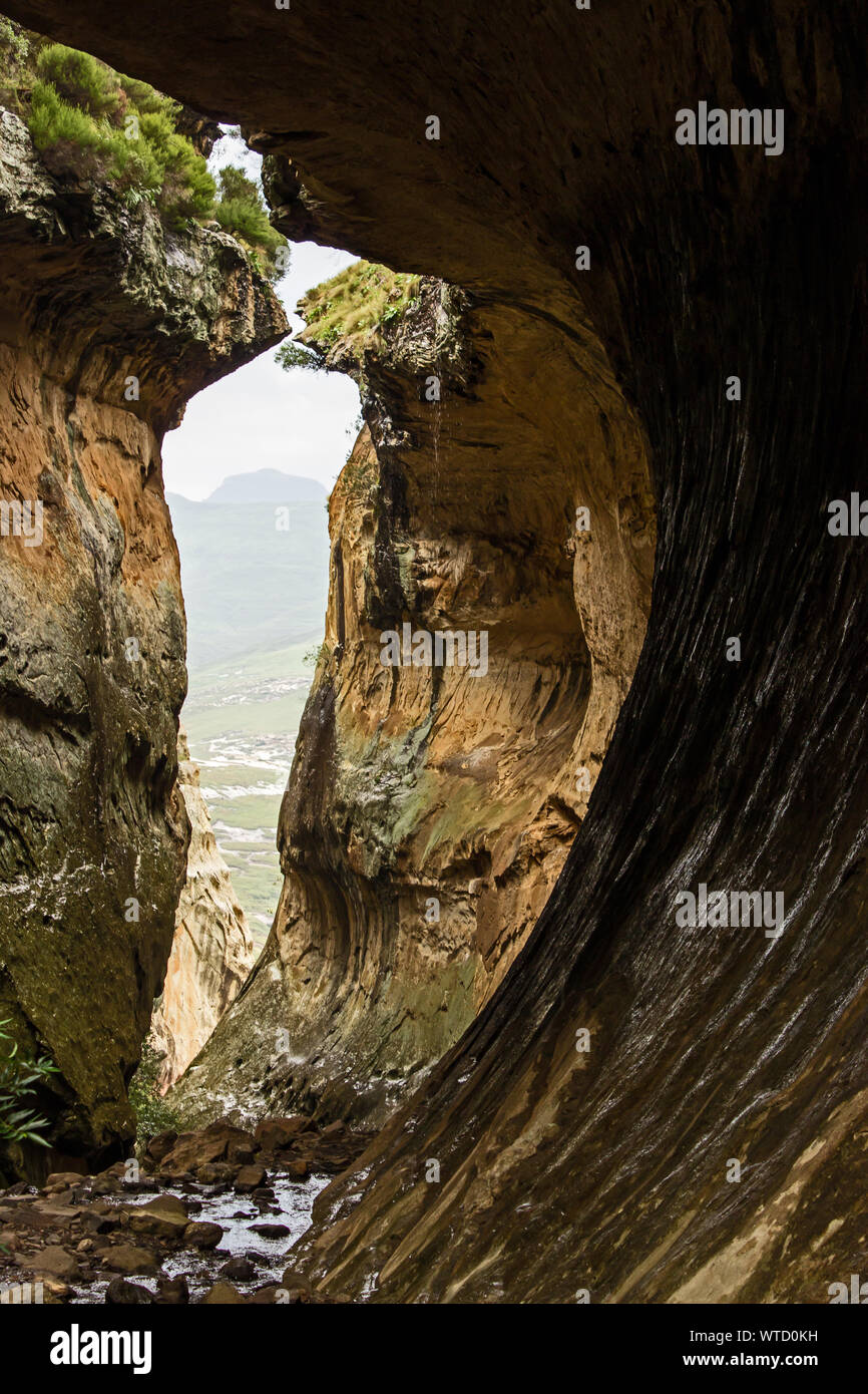 Inside the Eco Ravine, a slot canyon in Clarens Sandstone, looking out, photographed in the Golden Gate National Park, South Africa Stock Photo