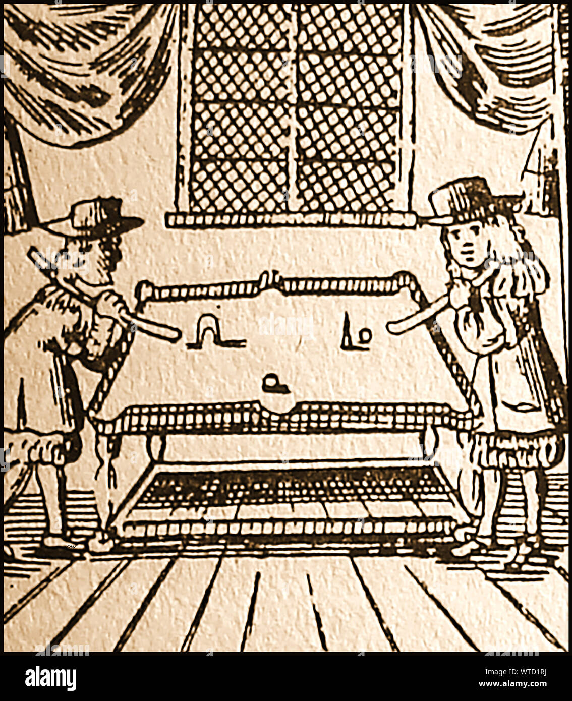 17th century games and pastimes in Britain - A woodcut from the time showing people playing table-croquet Stock Photo