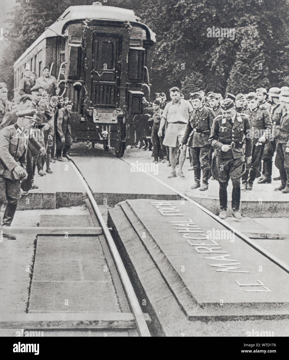 The historic wagon is brought back to the place of the Compiegne forest; or Marechal Foch; in 1918; had the armistice signed to the German plenipotent Stock Photo