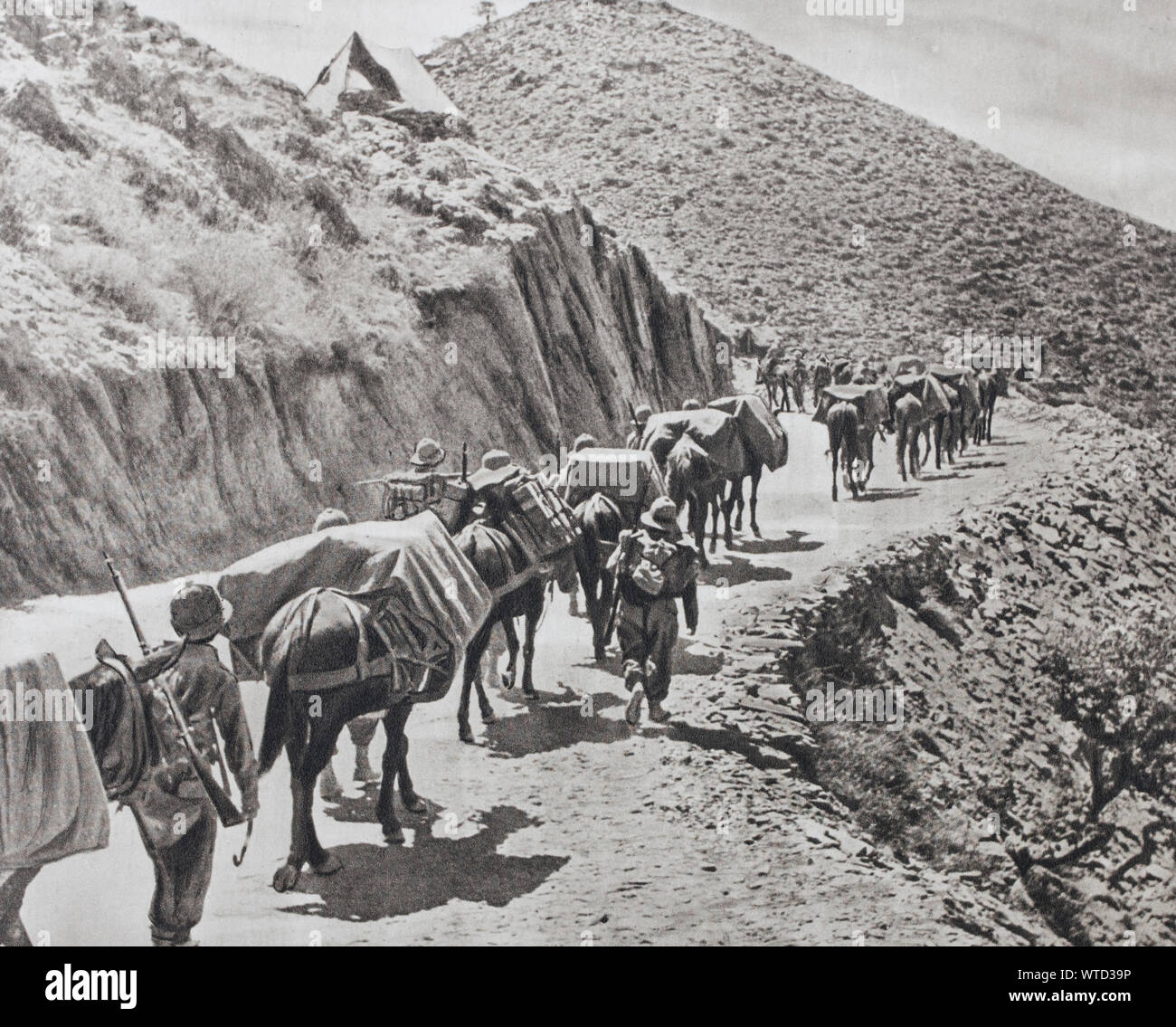 The destruction of the Italian army in East Africa. An Italian transport column in motion in the mountains of Abyssinia. The abrupt nature of the coun Stock Photo