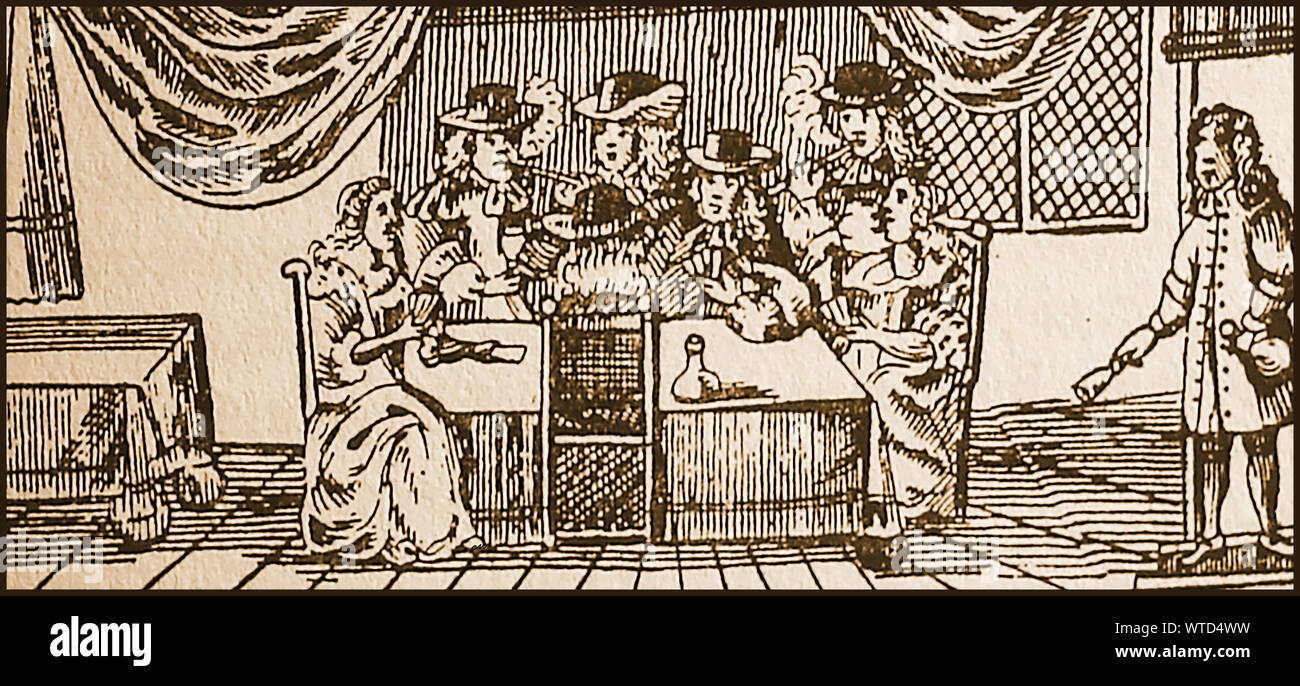 17th century games and pastimes in Britain  - A woodcut from the time showing men and women playing cards. A servant stands on the side of the drawing room  ringing a bell Stock Photo