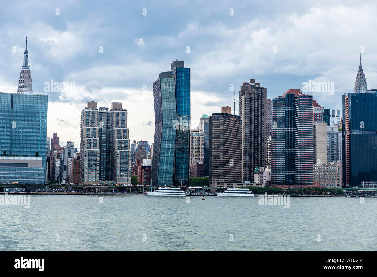 Skyline of skyscrapers in Manhattan from East River in New York City ...