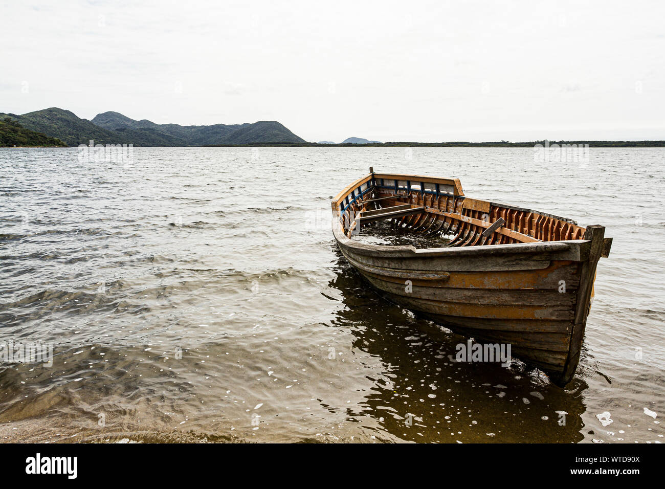 Wrecked wooden boat at Conceicao Lagoon. Florianopolis, Santa Catarina, Brazil. Stock Photo