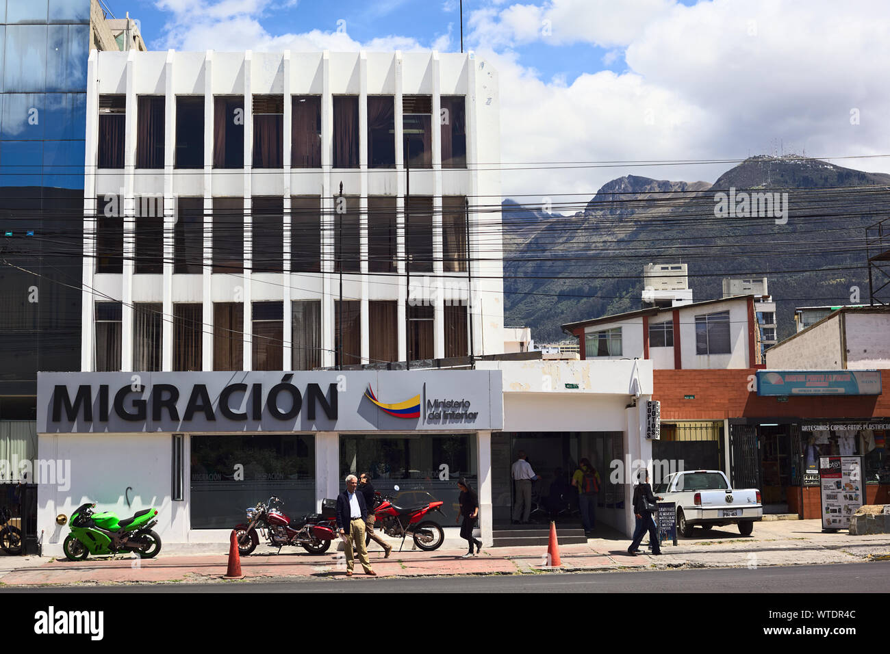 QUITO, ECUADOR - AUGUST 4, 2014: Unidentified people in front of the Migracion (Migration office) building on Amazonas Avenue on August 4, 2014 Stock Photo