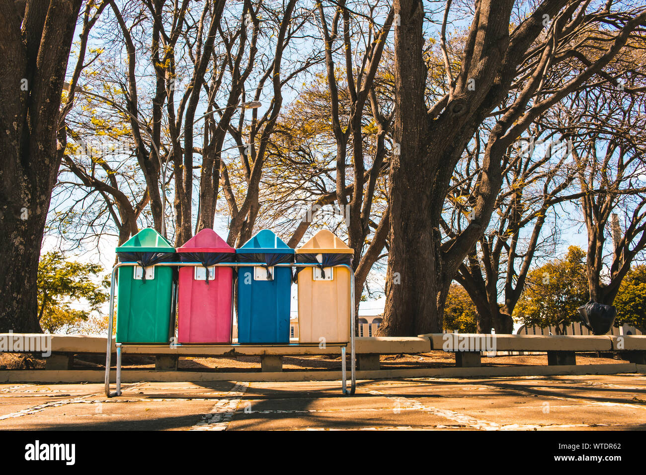 Photo of bins for selective collection in a square. Stock Photo