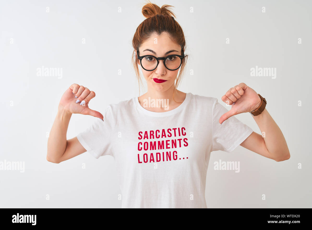 Redhead woman wearing funny t-shirt with irony comments over isolated ...