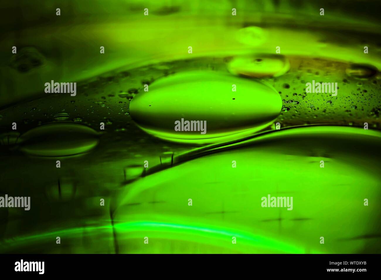 Abstract Image Of Green Water Bubbles On Glass Stock Photo