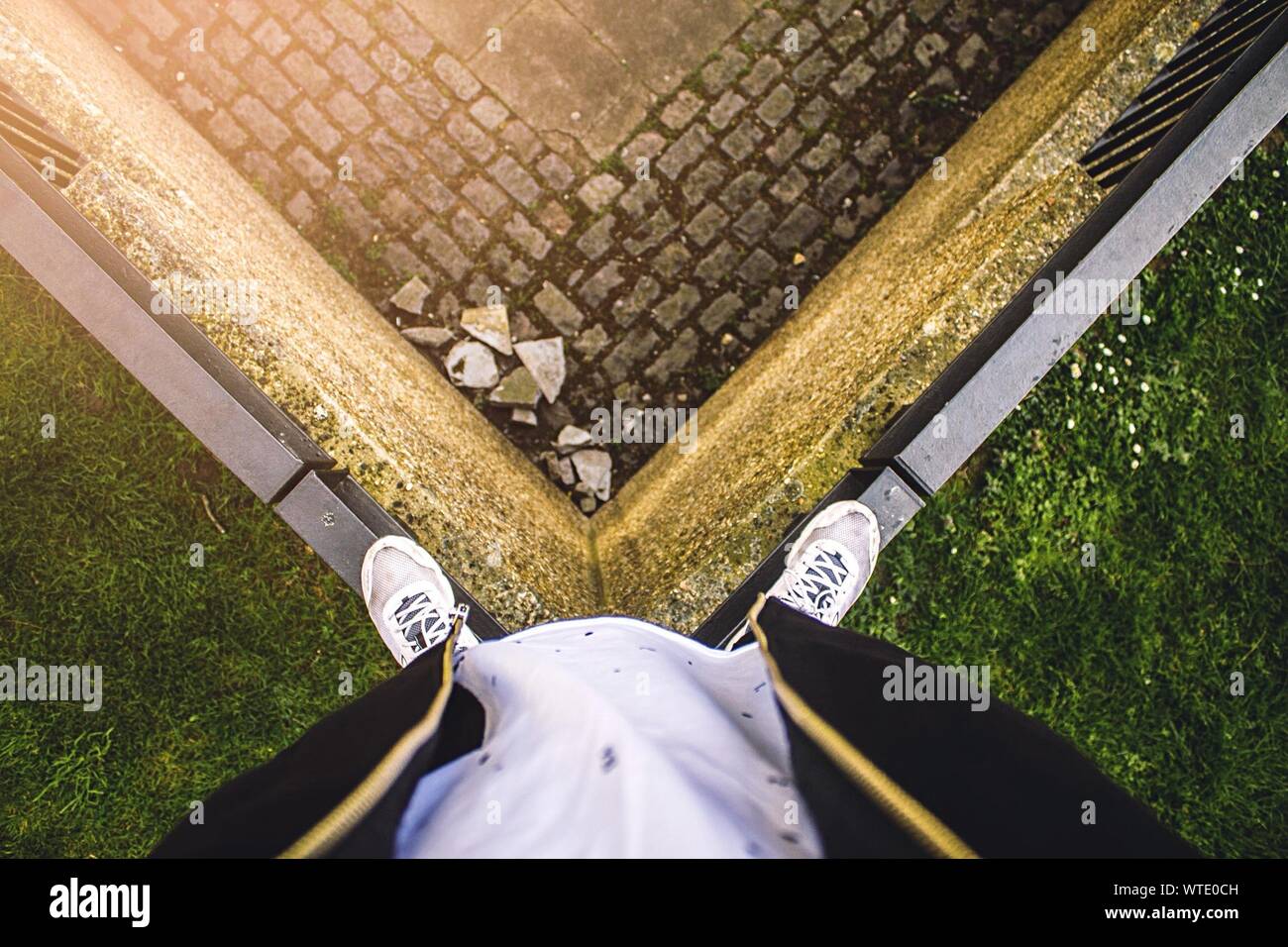 Man Standing On Corner Of Railing Stock Photo Alamy