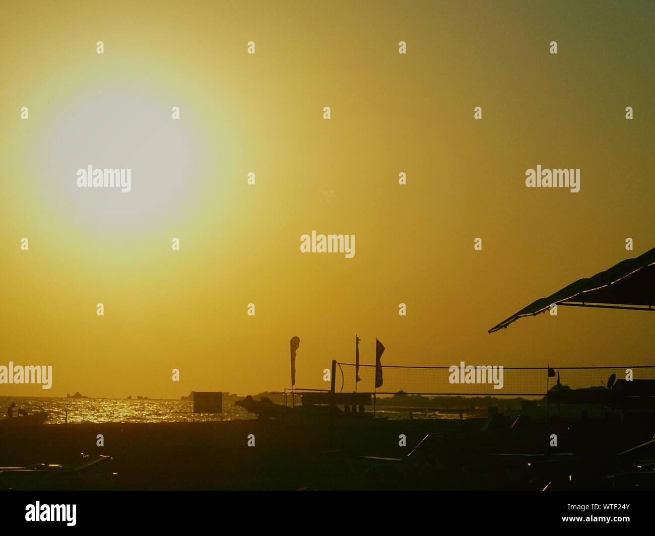Scenic View Of Beach At Sunset Stock Photo