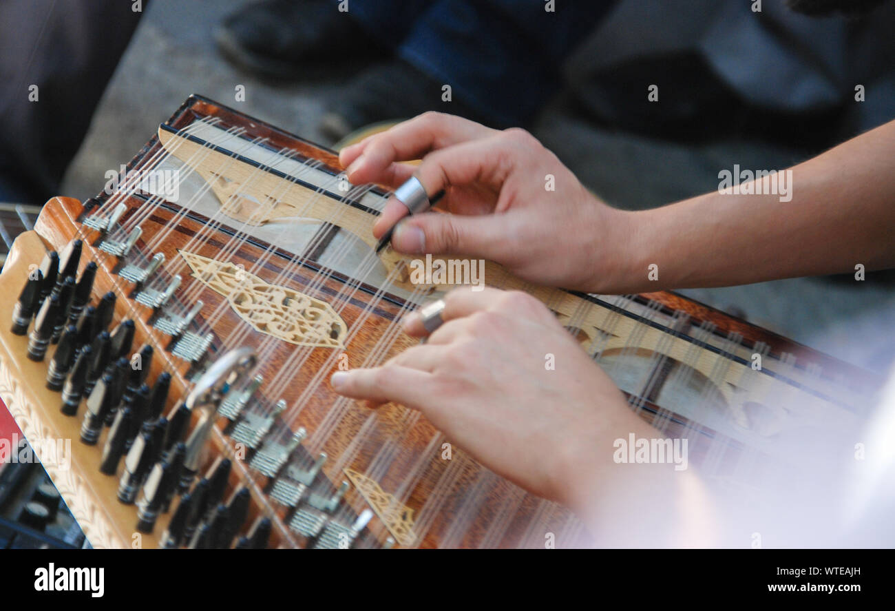 Two Hands Playing Turkish Qanon Musical Instrument. Selective focus ...