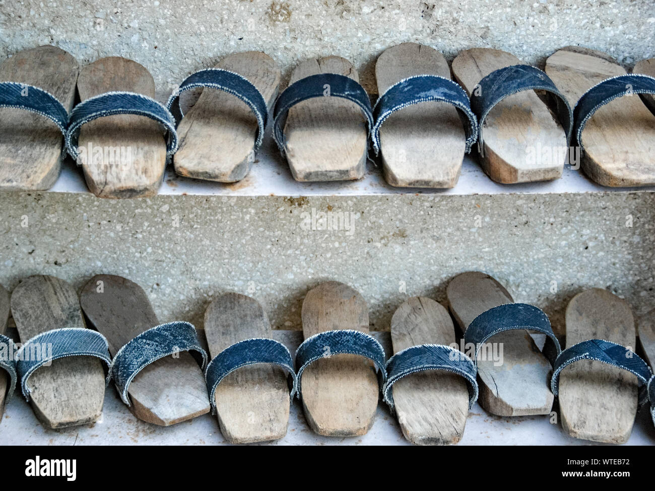 Many of clogs or Turkish wooden slippers. shoes with a thick wooden sole. Stock Photo